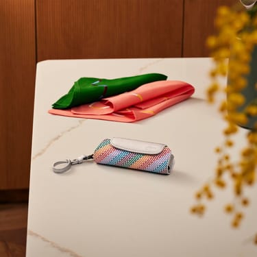 Ploom Aura Multicolored Patterned Canvas Solo Carry Case accessory on a table