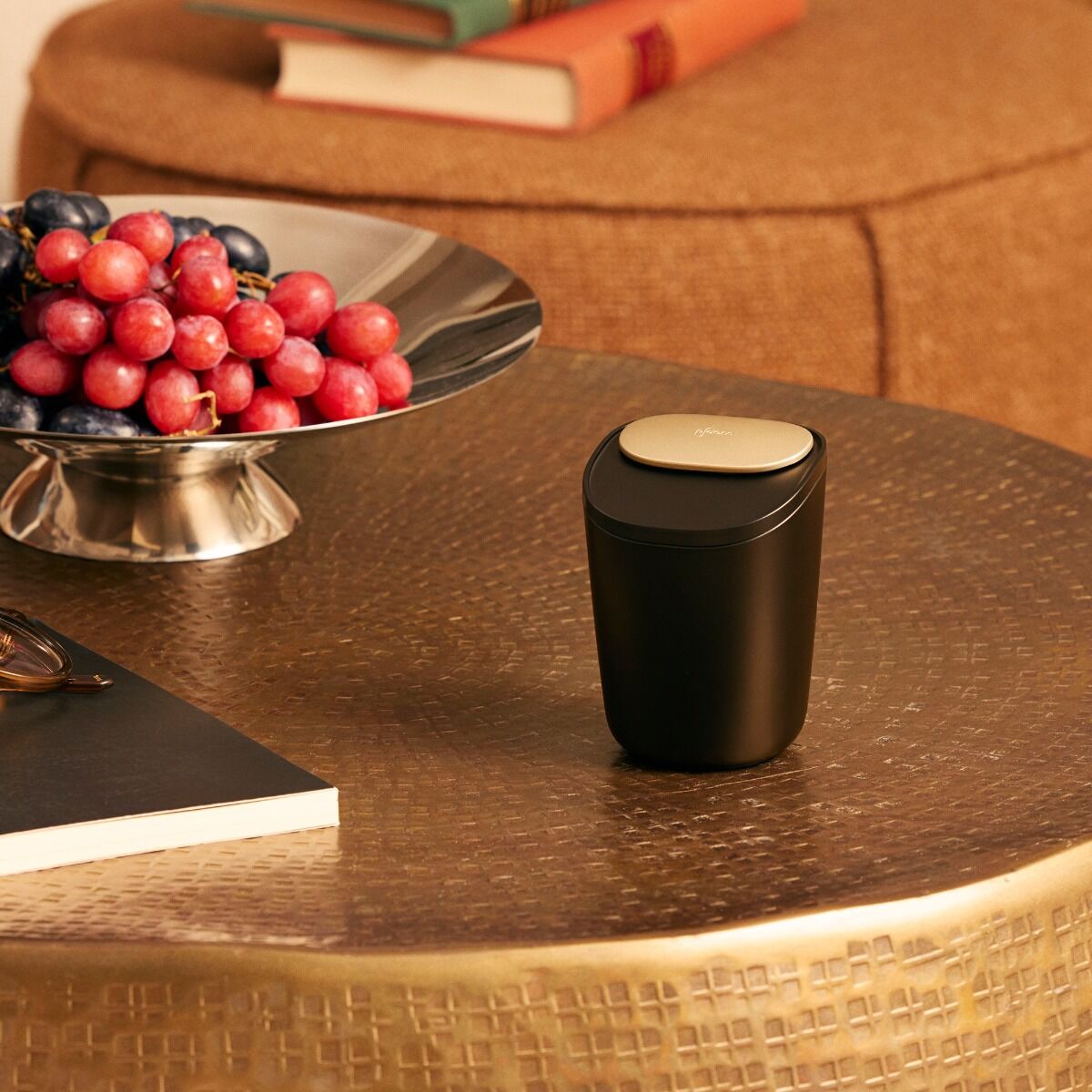 Ploom Large Stick Tray standing on a brown table