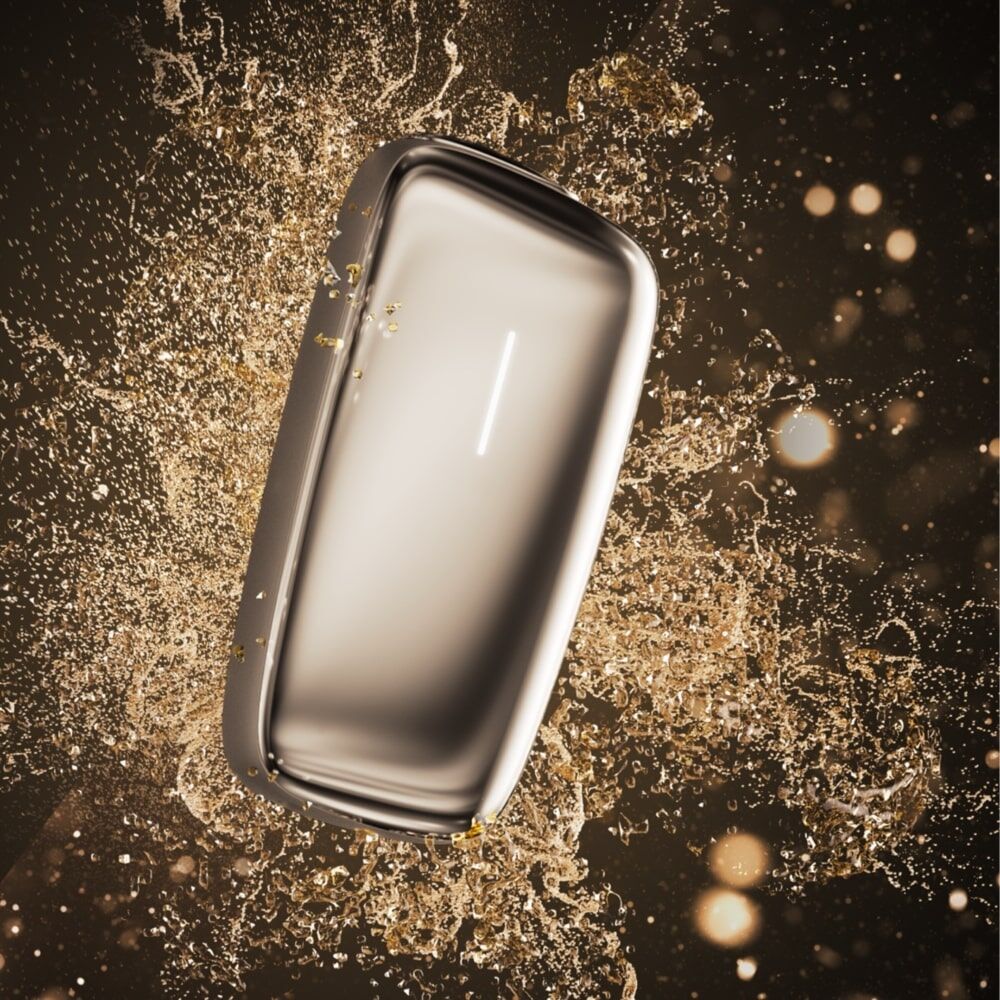 Ploom X Advanced Gold vizualı — qara fon üzərində gold hissəciklərlə