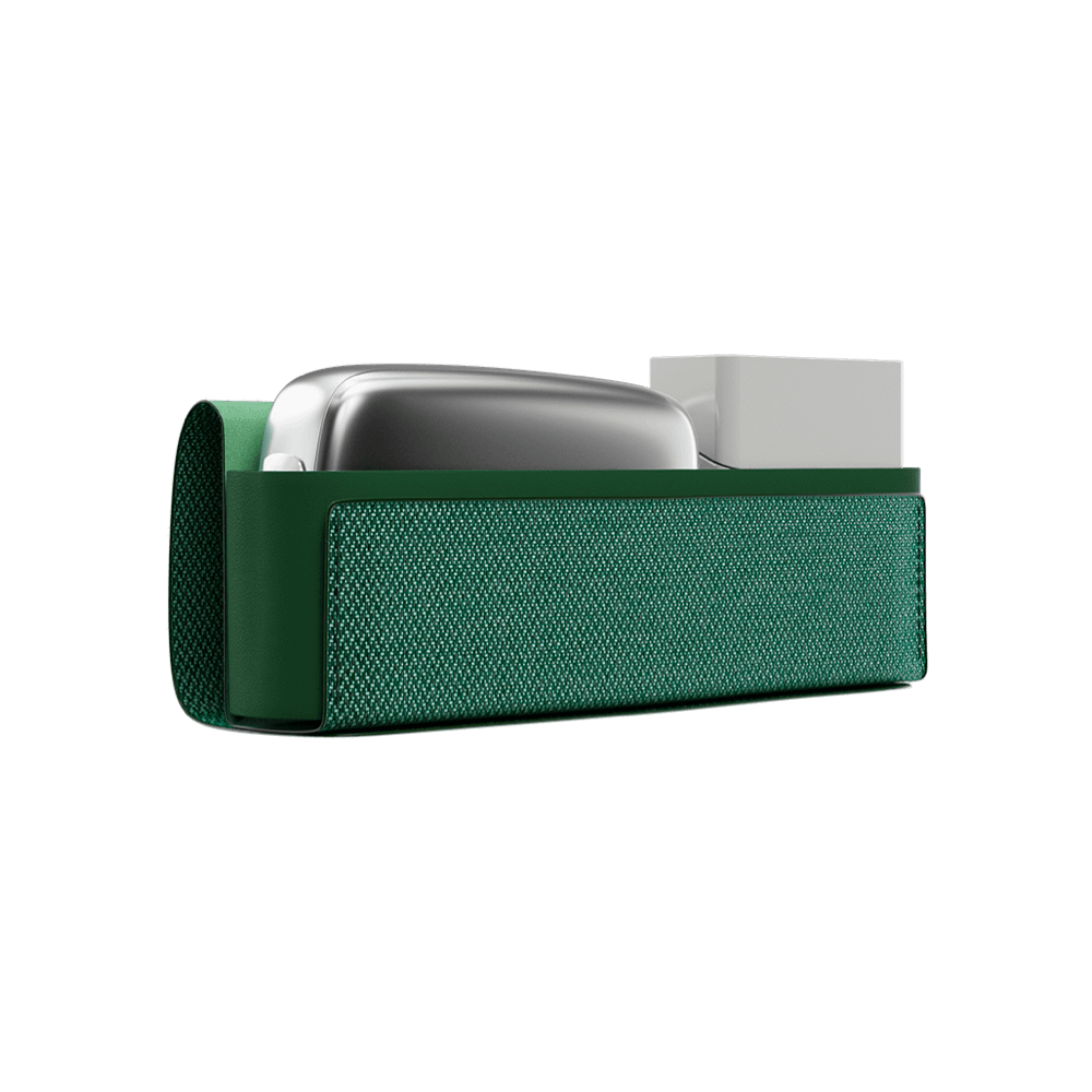 Ploom X Advanced fabric carry case green shown with a Ploom device and a pack of sticks inside.
